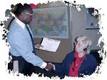 CEO Martin congratulates Mary Ann Walls who received the first customer request for a nationwide listing.