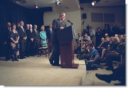President Bush signs the 2002 Farm Bill accompanied by Congress members.